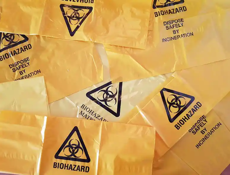 Biohazard bags with text instructing to dispose safely by incineration.